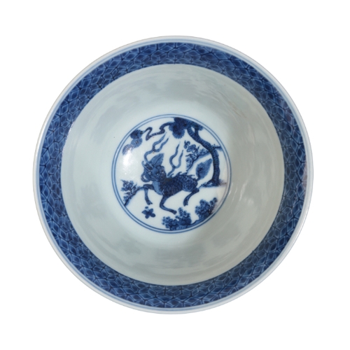 128 - A CHINESE BLUE AND WHITE BOWL early Qing or later, with an everted rim, decorated with goats in a la... 