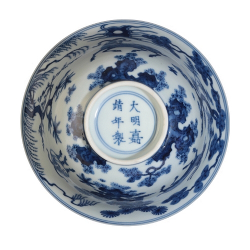 128 - A CHINESE BLUE AND WHITE BOWL early Qing or later, with an everted rim, decorated with goats in a la... 