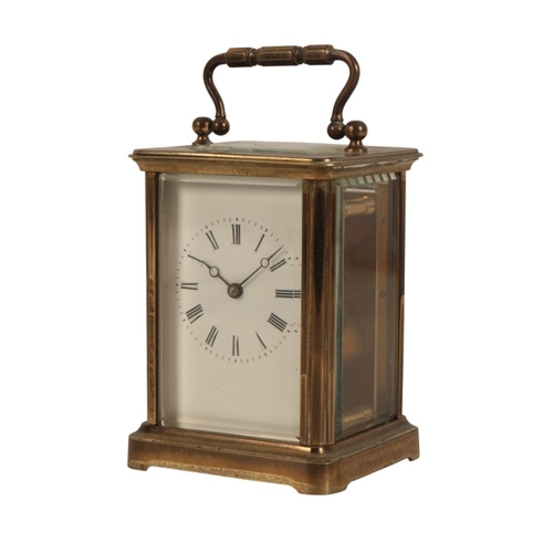 123 - A FRENCH BRASS CASED CARRIAGE CLOCK

19th century, with white enamelled dial, contained in corniche ... 