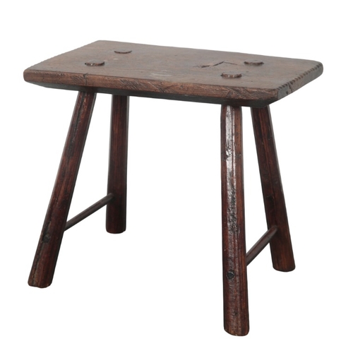 188 - AN ELM AND STAINED WOOD MILKING STOOL

19th/early 20th century, the rectangular top with chip carved... 