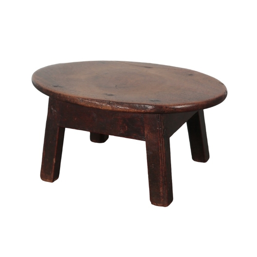 188 - AN ELM AND STAINED WOOD MILKING STOOL

19th/early 20th century, the rectangular top with chip carved... 