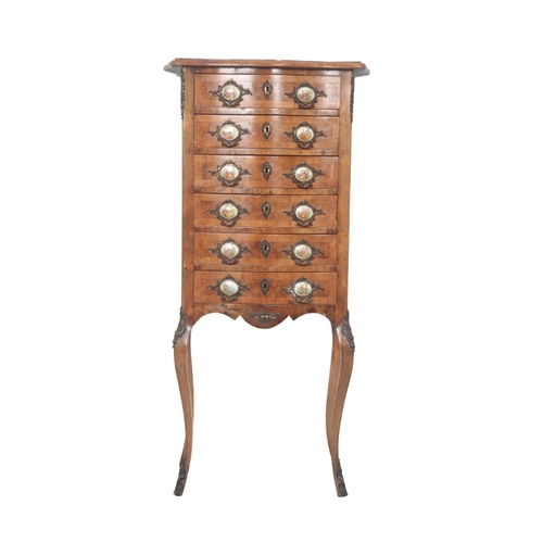 235 - A LOUIS XV STYLE SERPENTINE FRONT CHEST OF DRAWERS

the six short drawers all with gilt metal and en... 