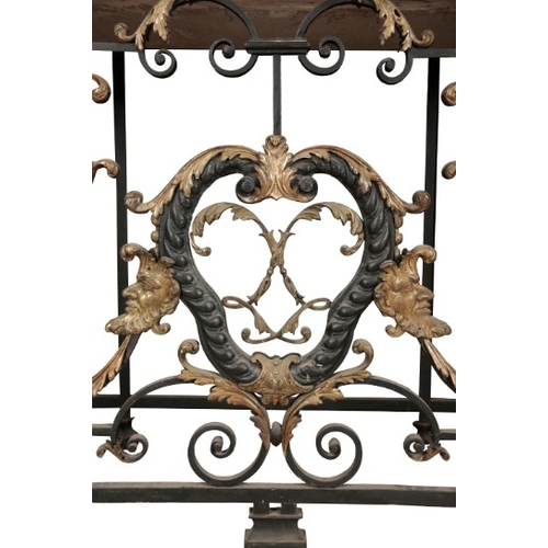 236 - AN IMPORTANT PAIR OF REGENCE WROUGHT IRON AND GILT CONSOLE TABLES

in the manner of Guillaume Cressa... 