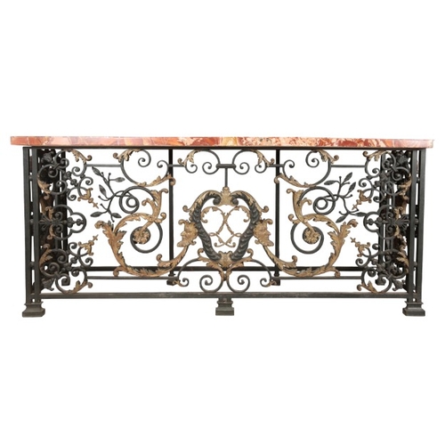 236 - AN IMPORTANT PAIR OF REGENCE WROUGHT IRON AND GILT CONSOLE TABLES

in the manner of Guillaume Cressa... 