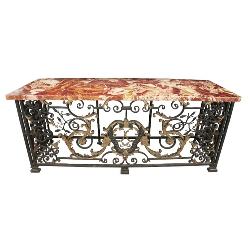 236 - AN IMPORTANT PAIR OF REGENCE WROUGHT IRON AND GILT CONSOLE TABLES

in the manner of Guillaume Cressa... 