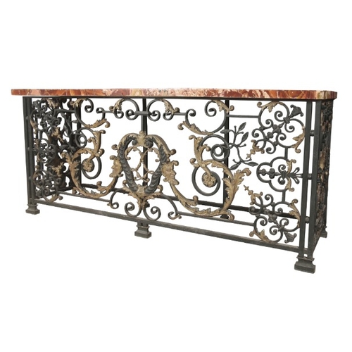 236 - AN IMPORTANT PAIR OF REGENCE WROUGHT IRON AND GILT CONSOLE TABLES

in the manner of Guillaume Cressa... 