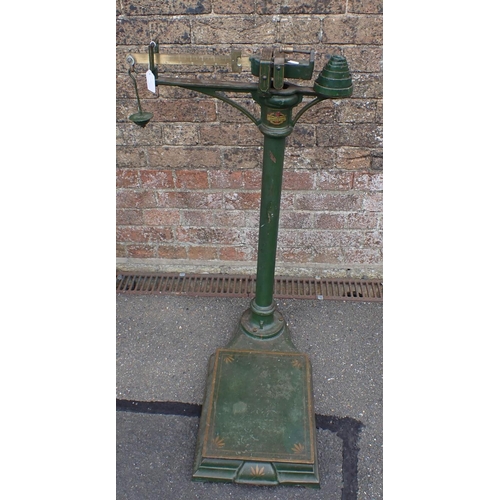 114 - JOHN BELL & ROYDEN ARNOLD AND SONS SCALES painted green, 88cms height with balance weights