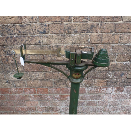114 - JOHN BELL & ROYDEN ARNOLD AND SONS SCALES painted green, 88cms height with balance weights