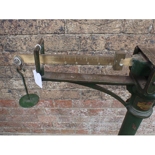 114 - JOHN BELL & ROYDEN ARNOLD AND SONS SCALES painted green, 88cms height with balance weights