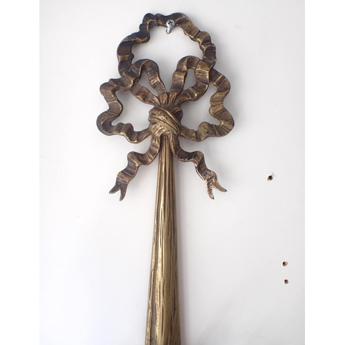 119 - A PAIR OF NEOCLASSICAL STYLE CAST BRASS CANDLE APPLIQUES of tied ribbon design, twin scrolling branc... 