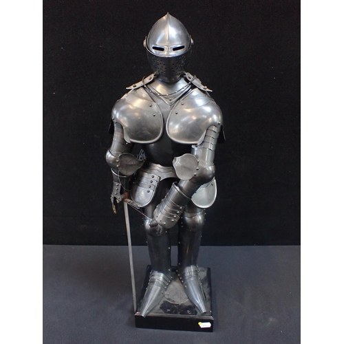 120 - A DECORATIVE MINIATURE SUIT OF ARMOUR on a black base  67cm high