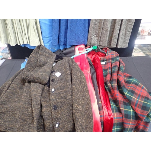 127 - A TARTAN WOOL CAPE with a quantity of vintage womens' dresses, mostly home made