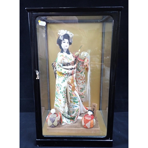 144 - A JAPANESE DRESSED DOLL, CASED labelled 'Princess  Yaegaki', the case 54cm high