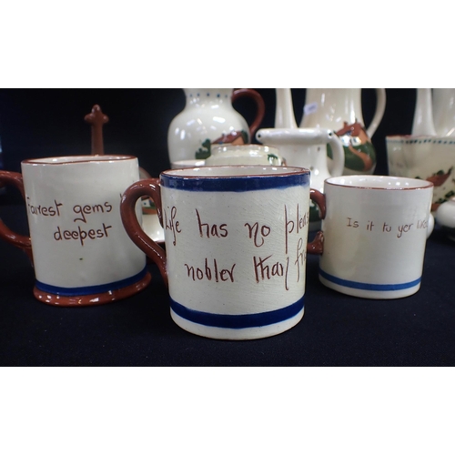 161 - A COLLECTION OF DEVON MOTTO WARE to include teapots, jugs and bowls