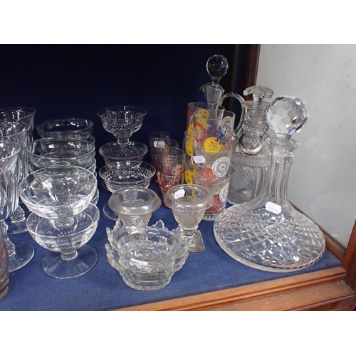 166 - A COLLECTION OF GLASSWARE including cut glass decanters and jugs, a pair of small urns, wine glasses... 