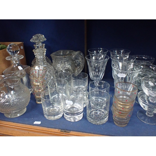 166 - A COLLECTION OF GLASSWARE including cut glass decanters and jugs, a pair of small urns, wine glasses... 
