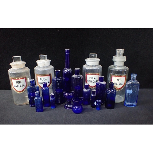173 - A SET OF GLASS APOTHECARY JARS WITH INLAID LABELS tallest 21cms, and a quantity of blue glass medici... 