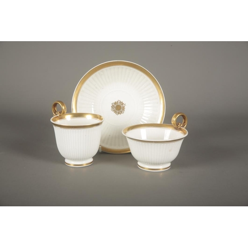 46 - A SWANSEA PORCELAIN TRIO c.1815, of fluted form and parcel gilt decoration, the coffee cup 8.5cm hig... 