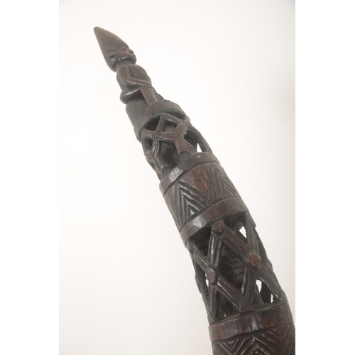 102 - A PAIR OF AFRICAN CARVED HARDWOOD TUSK SCULPTURES

21st century, elaborately pierced and carved with... 