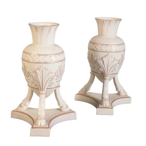 112 - A PAIR OF BELLEEK FIRST PERIOD PORCELAIN AMPHORA VASES

with gilt highlights, on three cloven hooves... 