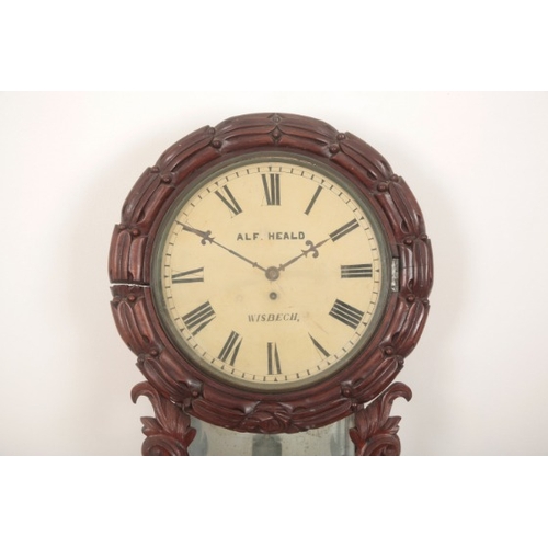 132 - A VICTORIAN WALL CLOCK BY 'ALF HEALD, WISBECH'

the circular dial surrounded by carved mahogany laur... 