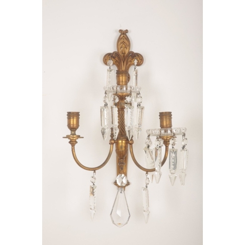 140 - A PAIR OF GILT METAL THREE SCONCE WALL LIGHTS

of 18th century style, the circular sconces with glas... 