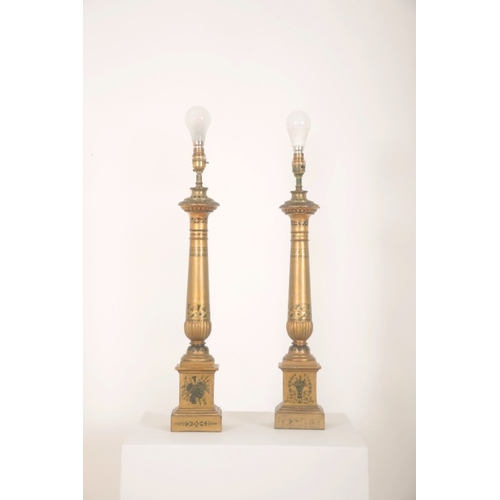 146 - A PAIR OF GILTWOOD COLUMN LAMPS

painted with classical iconography including cornucopiae and martia... 