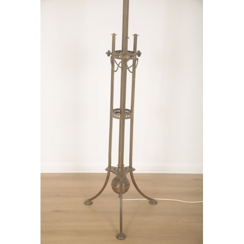 147 - A BRASS EDWARDIAN STANDARD LAMP OF REGENCY STYLE

early 20th century, the central column with two pi... 