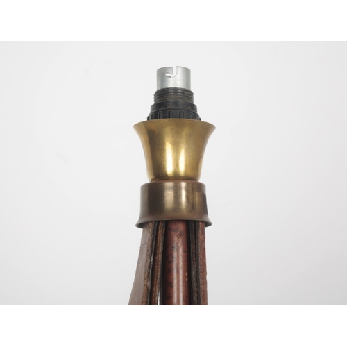 153 - A HERMÃS STYLE STIRRUP LAMP

of leather and brass construction terminating on circular base, 68.5cm... 