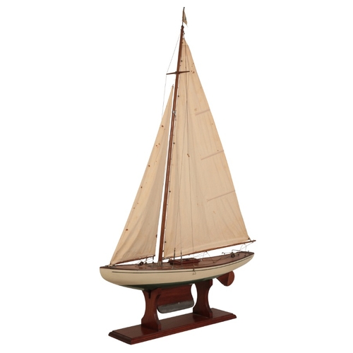 173 - A MODEL POND YACHT WITH STAND

early 20th century, 120cm high (to top of flag and including base) x ... 