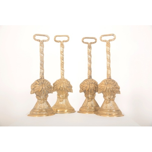 193 - A COLLECTION OF DOOR PORTERS

two pairs of brass wheat sheafs, 39cm high, together with a smaller pa... 