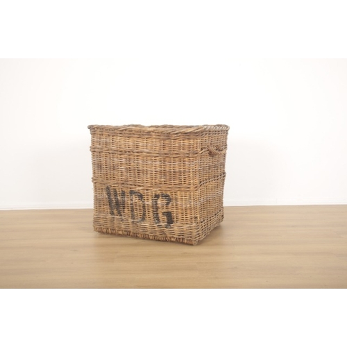 195 - A VICTORIAN COUNTRY HOUSE WICKER LOG BASKET

with looped woven handles and resting on wood supports,... 