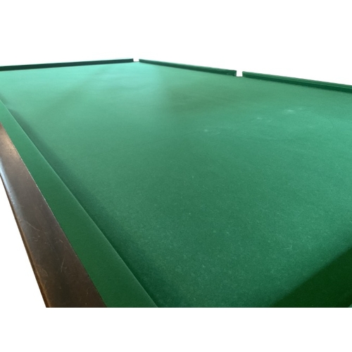 208 - A VICTORIAN MAHOGANY BILLIARDS TABLE

the green baize lined playing surface on eight turned and reed... 