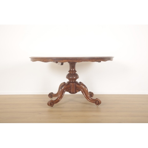 219 - A VICTORIAN BURR WALNUT OVAL OCCASIONAL TABLE

late 19th century, scalloped edge, heavily carved cen... 