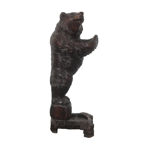 225 - A BLACK FOREST CARVED BEAR STICK OR UMBRELLA STAND

late 19th/early 20th century, with glass eyes an... 