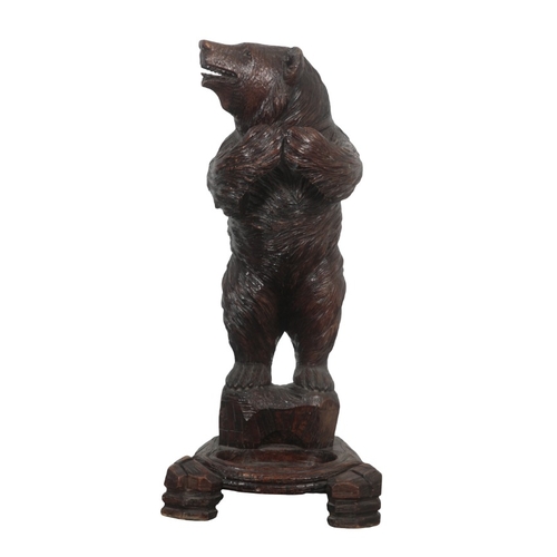 225 - A BLACK FOREST CARVED BEAR STICK OR UMBRELLA STAND

late 19th/early 20th century, with glass eyes an... 