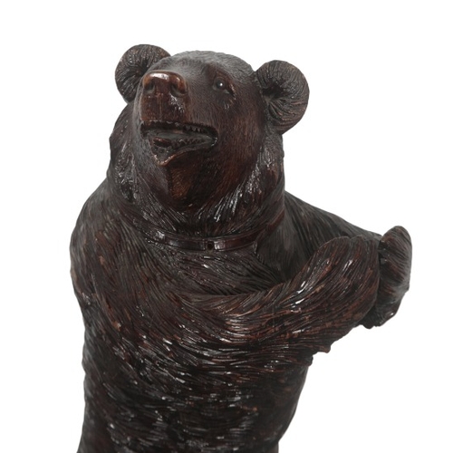 225 - A BLACK FOREST CARVED BEAR STICK OR UMBRELLA STAND

late 19th/early 20th century, with glass eyes an... 