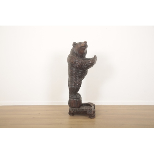 225 - A BLACK FOREST CARVED BEAR STICK OR UMBRELLA STAND

late 19th/early 20th century, with glass eyes an... 