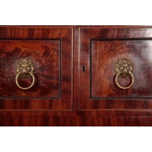 229 - A GEORGE IV FIGURED MAHOGANY SECRETAIRE CHEST

with bead mounts and lions mask handles, the central ... 