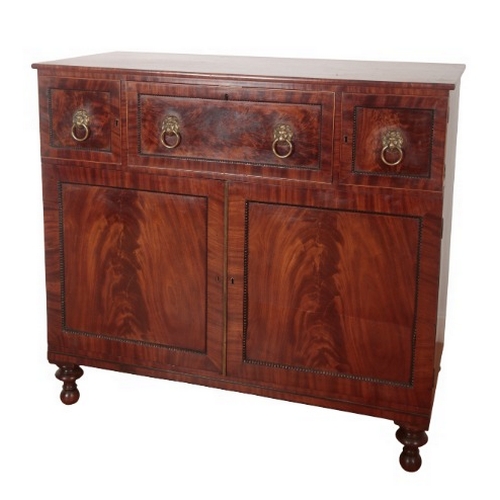 229 - A GEORGE IV FIGURED MAHOGANY SECRETAIRE CHEST

with bead mounts and lions mask handles, the central ... 