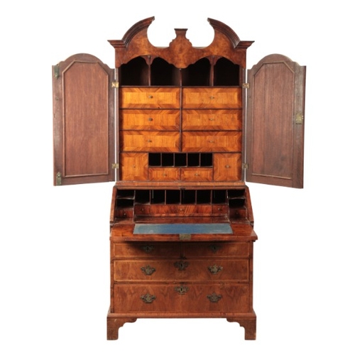 237 - A QUEEN ANNE WALNUT BUREAU BOOKCASE

early 18th century and later, the upper section with a broken s... 