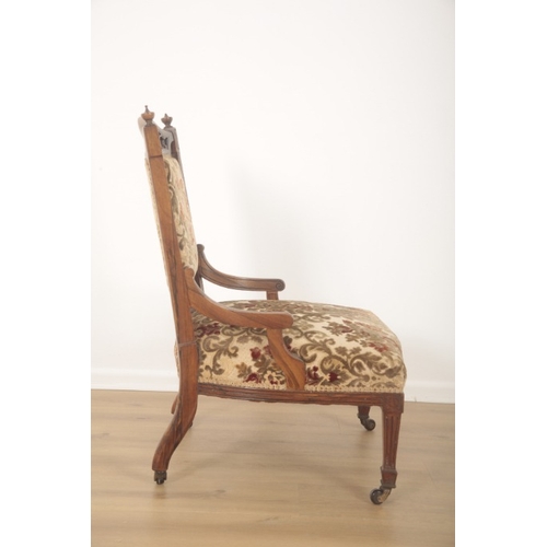 249 - A VICTORIAN ROSEWOOD NURSING OR OCCASIONAL LOW ARMCHAIR

late 19th century, the top rail with pierce... 