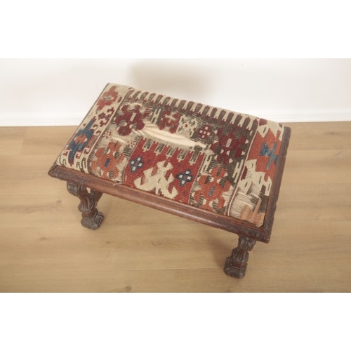 250 - A BAROQUE REVIVAL LOW STOOL

19th century, the drop in seat upholstered in a kilim, with elaborately... 