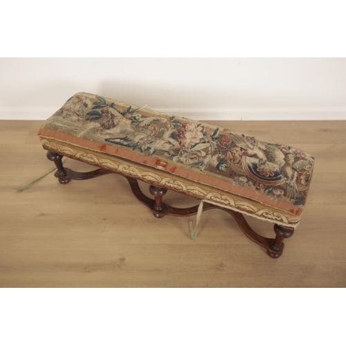 264 - A LONG LOW STOOL IN WILLIAM AND MARY STYLE

20th century, the rectangular seat upholstered in floral... 