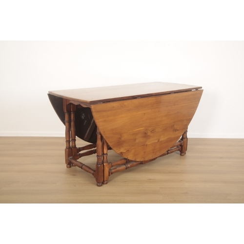 268 - A YEW WOOD OVAL GATELEG TABLE

of 18th century style, on slender turned legs, 75cm high x 152cm long... 