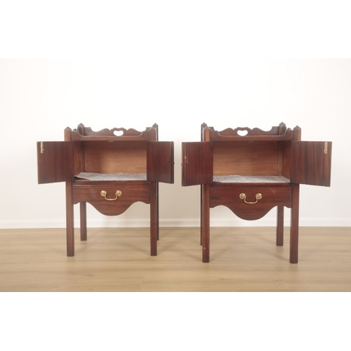 271 - A PAIR OF MAHOGANY NIGHT CUPBOARDS IN GEORGE III STYLE

the shaped galleries with handle cut-outs, e... 