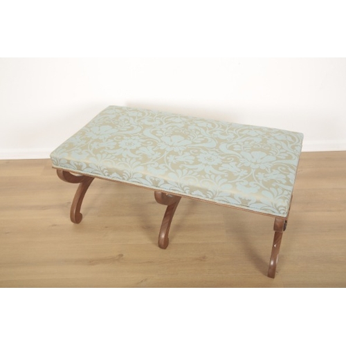 272 - A MAHOGANY LONG STOOL

of Victorian design, upholstered in pale blue leaf pattern damask, the 'X' pa... 