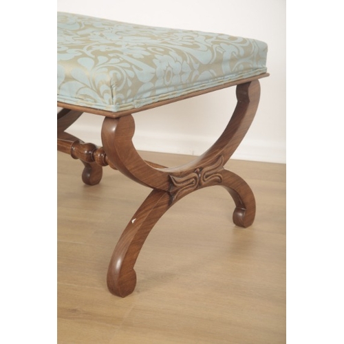 272 - A MAHOGANY LONG STOOL

of Victorian design, upholstered in pale blue leaf pattern damask, the 'X' pa... 