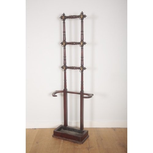 275 - A VICTORIAN MAHOGANY HALL STAND

the turned supports mounted with brass hooks, the square brass inse... 