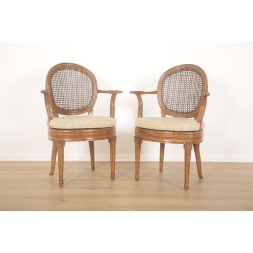 283 - A SET OF FIVE FRENCH CANED AND GRAINED BEECHWOOD ARMCHAIRS

20th Century, the oval concave backs wit... 